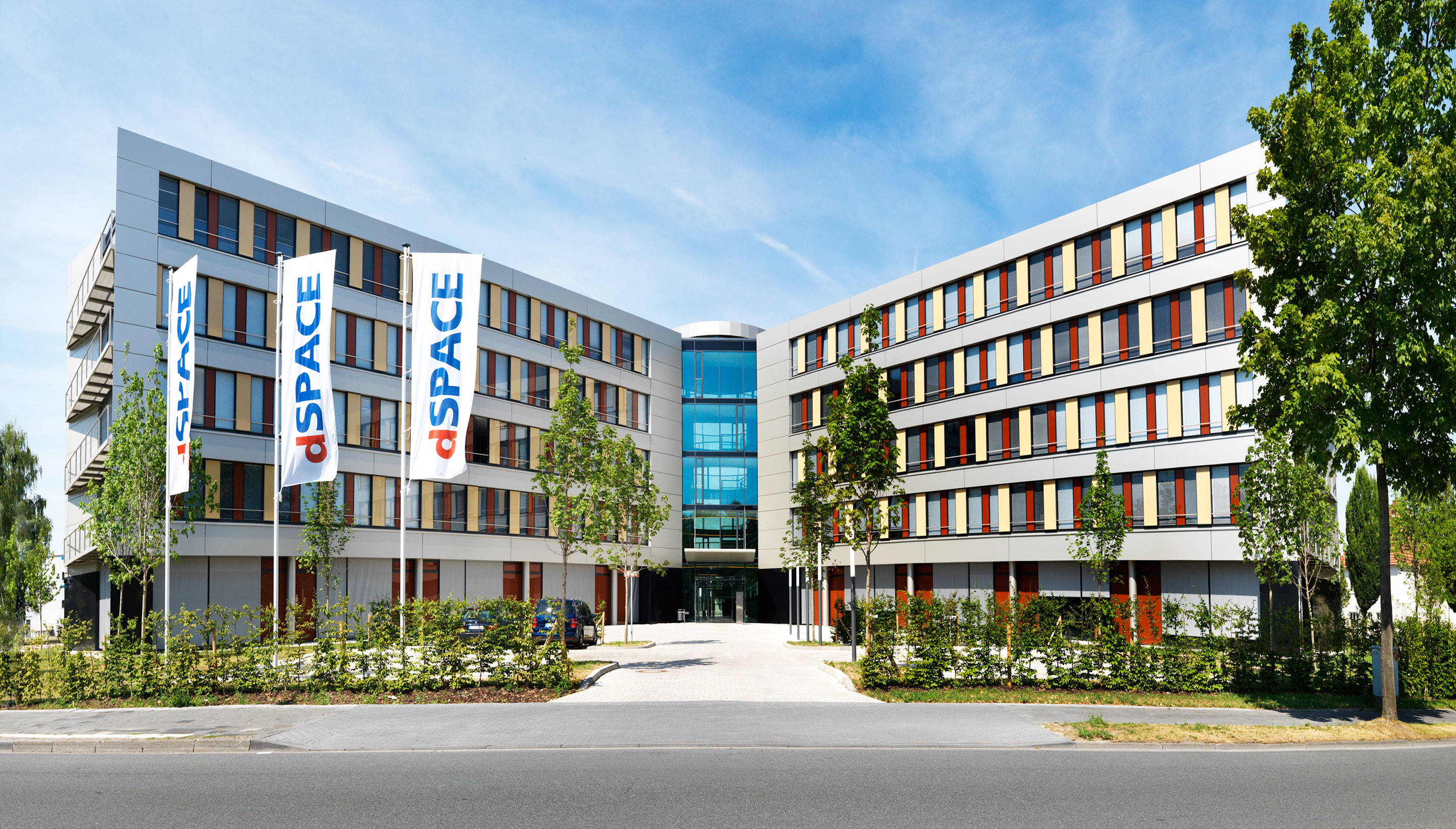 Modern headquarters of dSpace in Paderborn, Germany, showcasing a distinctive architectural design that reflects the company's innovation in simulation and validation solutions for the automotive industry.